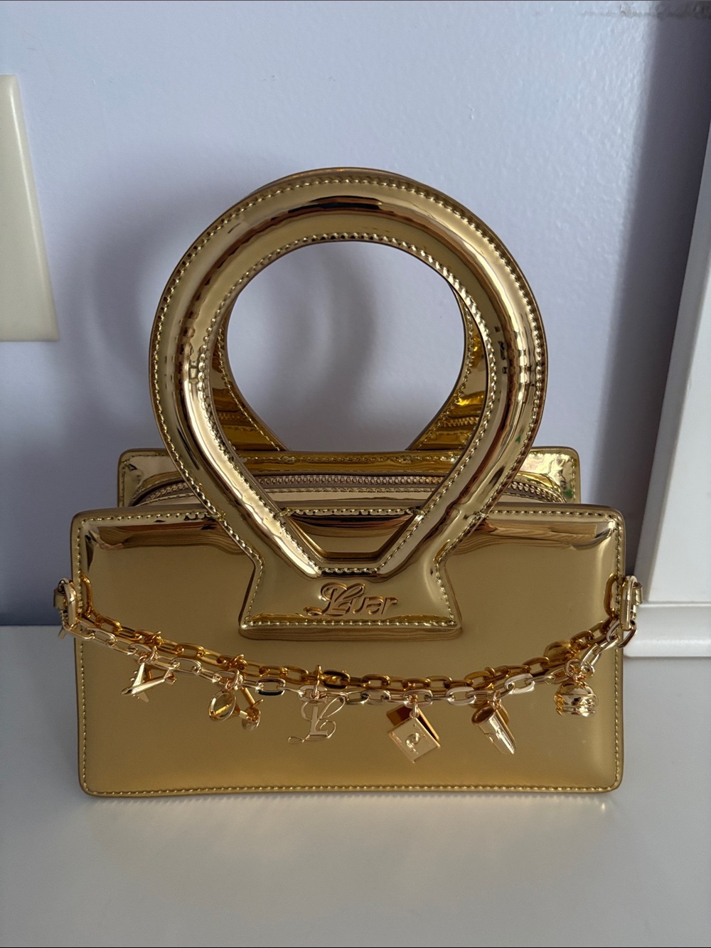 LUAR Gold Metallic Handbag with Charm Chain